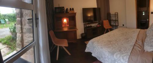 Ένα ή περισσότερα κρεβάτια σε δωμάτιο στο Chambre à la campagne