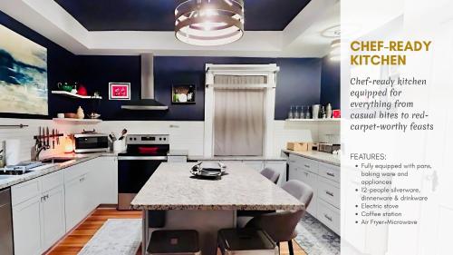 a kitchen with white cabinets and a table with chairs at Hollywood Glam Themed Manor with Sauna for 12-People in Lancaster
