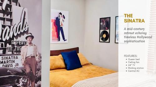 a bedroom with a bed and posters on the wall at Hollywood Glam Themed Manor with Sauna for 12-People in Lancaster