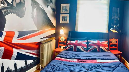 a bedroom with a bed with a british flag blanket at Hollywood Glam Themed Manor with Sauna for 12-People in Lancaster