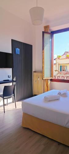 Ένα ή περισσότερα κρεβάτια σε δωμάτιο στο Leone XIV Firenze