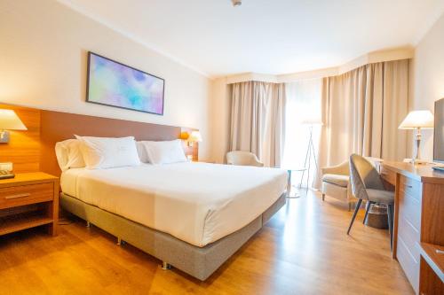 Katil atau katil-katil dalam bilik di Aparto-Hotel Rosales