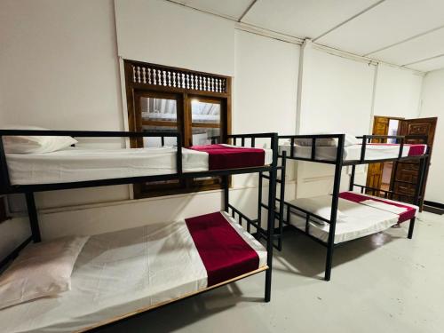 Postel nebo postele na pokoji v ubytování Trinco Chill Zone Hostel