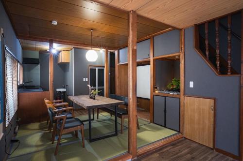 a kitchen and dining room with a table and chairs at 6-minute walk to Tokyo Skytree Up to 6 people 68 sqm fully renovated direct access to Asakusa, Shibuya, Narita Airport, and Haneda Airport in Tokyo