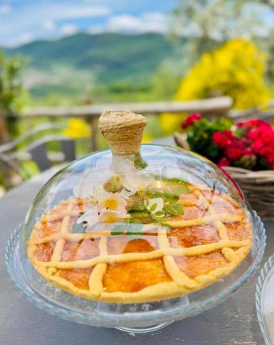 a glass bowl of food on a table at Agriturismo La Terrazza su Farfa in Castelnuovo di Farfa
