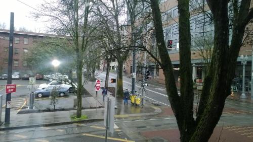 a view of a city street with a car on the road at Downtown Value Inn in Portland
