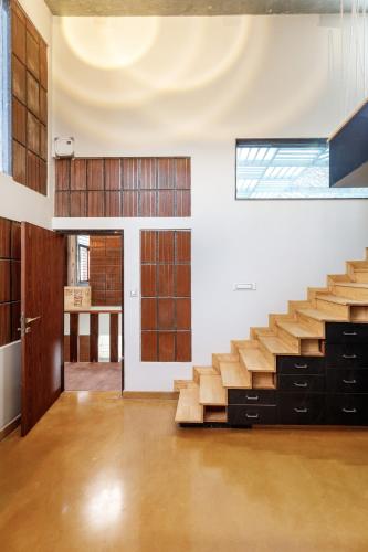an empty room with stairs in a building at Terrastone Duplex Spacious ApartmentNr Lake in Bengaluru