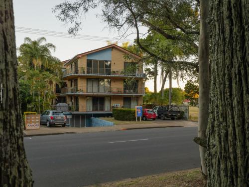 a building on the side of a street with cars parked at Stunner 2 min walk to beach in Torquay