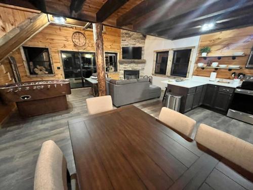 a living room with a table and chairs and a couch at Sage Hill Escape in Londonderry