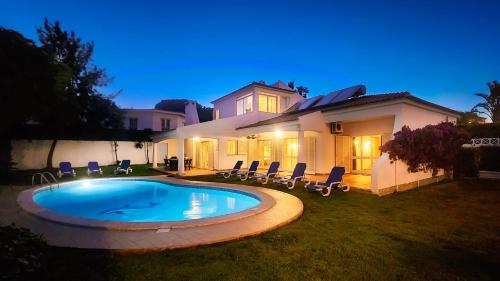 a swimming pool in the yard of a house at Solar - Private Pool - 12 Guests - Albufeira in Albufeira