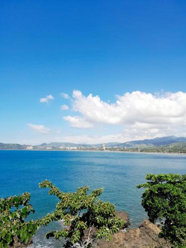 a view of a large body of water at Family getaway, pool, beach and surf in Jacó