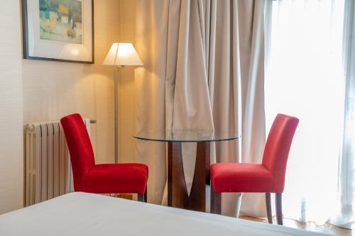 Katil atau katil-katil dalam bilik di Aparto-Hotel Rosales