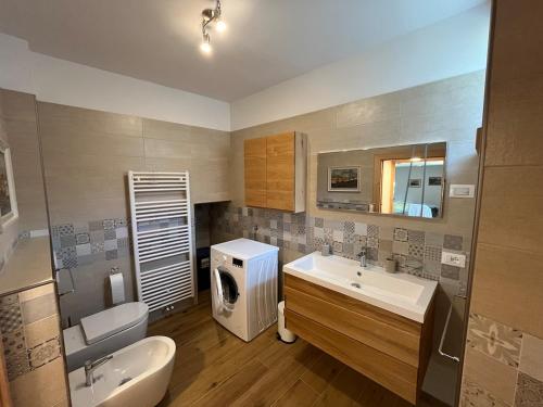 a bathroom with a sink and a toilet at Mountain Chalet in Strembo