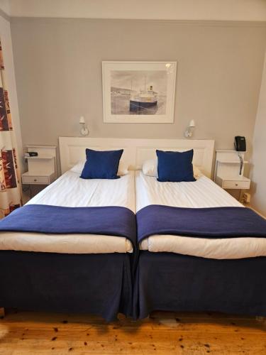Postel nebo postele na pokoji v ubytování Hotel Emma