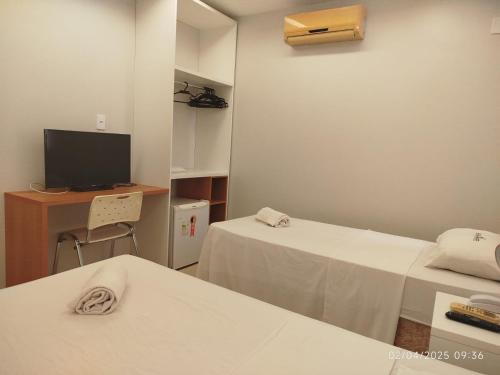 Un ou plusieurs lits dans un hébergement de l'établissement Bueno Palace Hotel