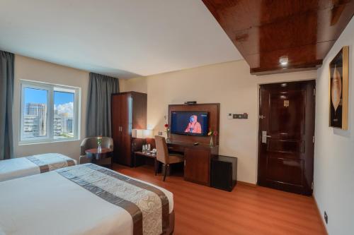 Ένα ή περισσότερα κρεβάτια σε δωμάτιο στο Park Avenue Hotel Nungambakkam