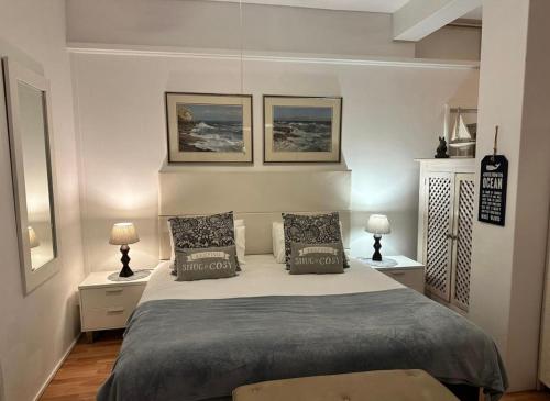 Postel nebo postele na pokoji v ubytování Garden Beach Cottage