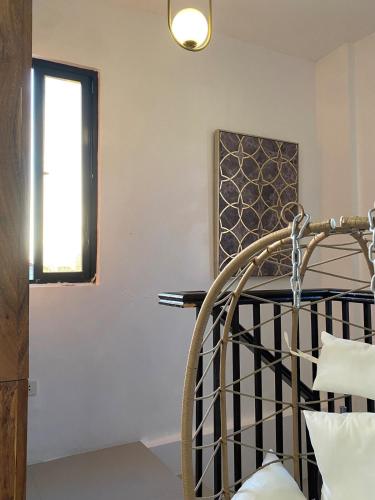 a room with a chair and a window at Ethereal Angel House in Silang