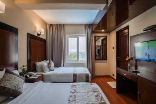 Postel nebo postele na pokoji v ubytování Park Avenue Hotel Nungambakkam