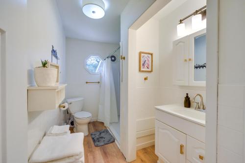 a white bathroom with a sink and a toilet at 8 Mi to Dtwn Duluth Hermantown Home in Hermantown