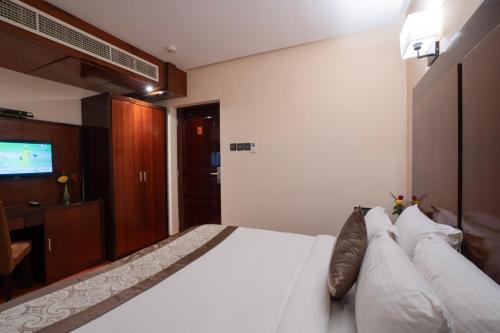 Ένα ή περισσότερα κρεβάτια σε δωμάτιο στο Park Avenue Hotel Nungambakkam