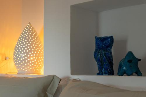 Postel nebo postele na pokoji v ubytování Il trullo di simona