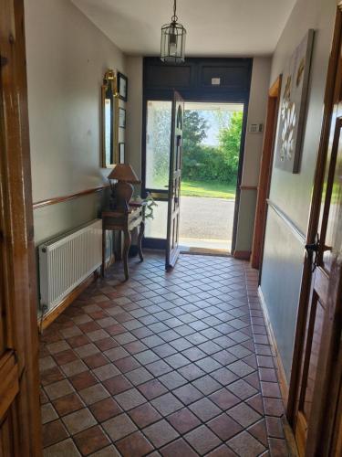 a hallway with a door open to a room with a desk at Relaxing Break at Coshel View in Foyle Bridge