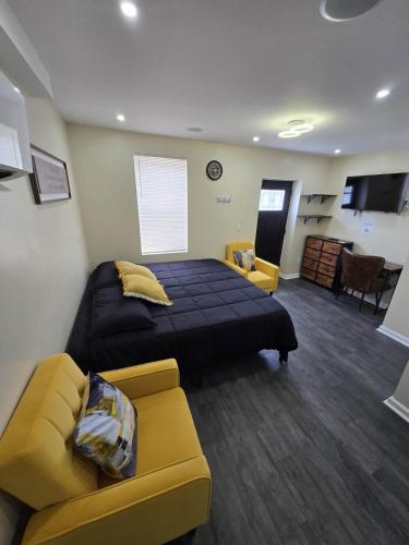 a bedroom with a bed and a couch in a room at G O G Building in Darby