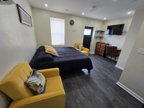 a bedroom with a bed and a couch at G O G Building in Darby