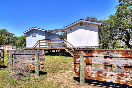 a building with a ramp and a house at Fantasy Oaks Lodge in Aransas Pass