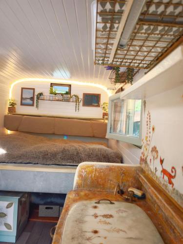 a bathroom with two beds and a sink in a room at Ekokemp Lipa in Štiavnické Bane