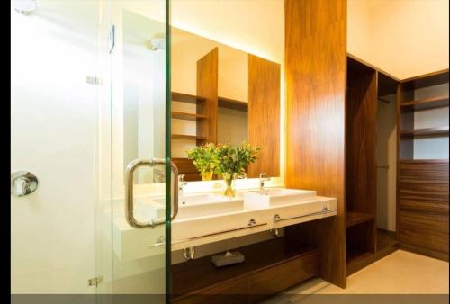 a bathroom with a sink and a mirror at Three New Beautiful Villas In Punta Cala in Nuevo Vallarta 