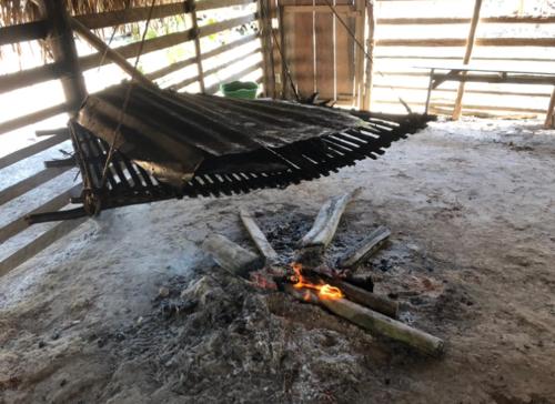 a grill with a fire in a room at Curupira Amazon Lodge - Private Jungle Tour, River Tour or Great Adventure Tour Included in the Walking Safari Price in Iranduba