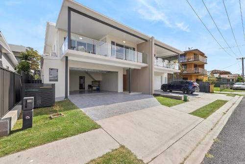an image of a house with a driveway at Sunnyside 15B Baldwin St South West Rocks - Full Linen Provided in South West Rocks