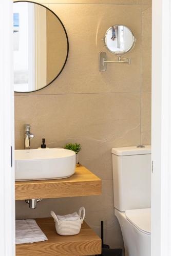 a bathroom with a sink and a mirror at Villa Talya in Peyia