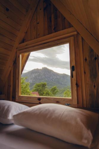 a window in a room with a view of a mountain at Mountain Camp Outdoor Tara in Tjentište