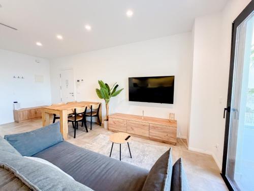 a living room with a couch and a table at El Campello Ocean View Escape in La Venteta