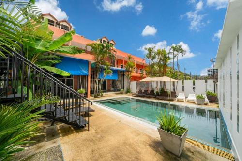 an image of a swimming pool in front of a building at Jungceylon Villa - quiet location, pool, maid in Patong Beach