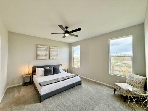 a bedroom with a bed and a ceiling fan at Cozy Chasm Cottage in Loveland