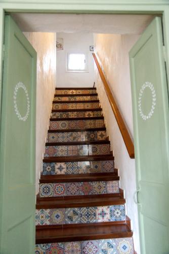 a set of stairs in a house with a backdoor at Agroturismo Binissafullet Vell in Sant Lluis