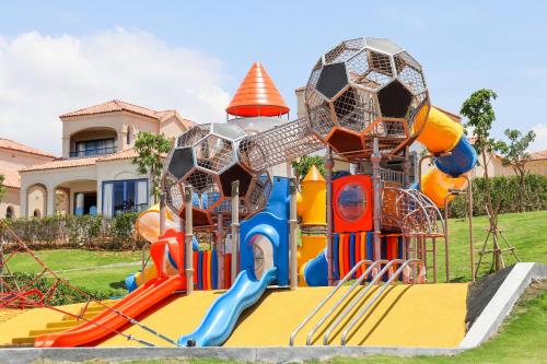 a playground with a bunch of different types of slides at Centara Mirage Resort Mui Ne in Mui Ne