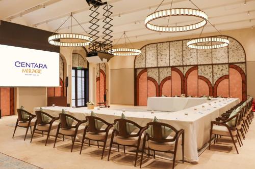 a large conference room with a long table and chairs at Centara Mirage Resort Mui Ne in Mui Ne
