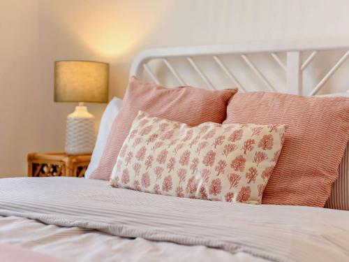 a bed with a pillow and a lamp on a table at 2 bed in Appledore 52863 in Appledore
