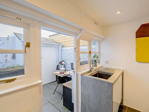a kitchen with a sink and a window at 2 bed in Appledore 52863 in Appledore