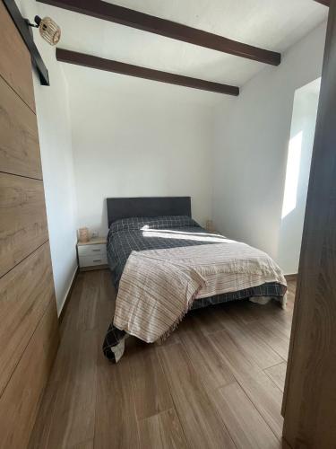 Ένα ή περισσότερα κρεβάτια σε δωμάτιο στο Casa Carlos