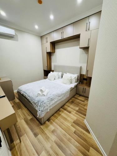 a bedroom with a bed with white towels on it at Hillside Boutique Hotel Baku in Baku