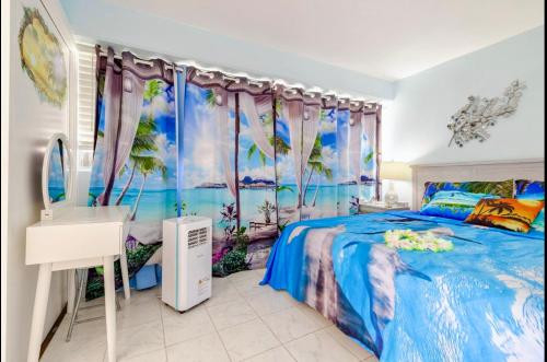 a bedroom with a bed and a sink and a mirror at WAIKIKI 2 BEDROOMS, 1 BATH, FREE PARKING, SLEEP 6 in Honolulu