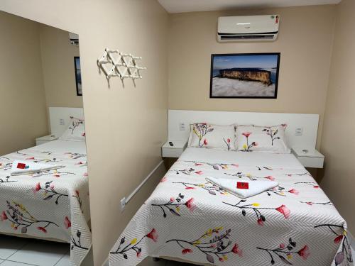 Postel nebo postele na pokoji v ubytování Roraima Apart Hotel