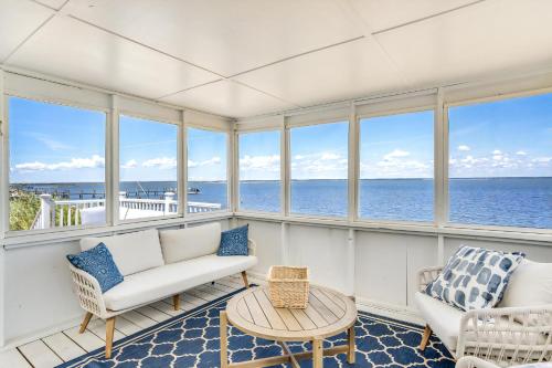 a living room with a view of the ocean at Shell Shack in Deep Hole