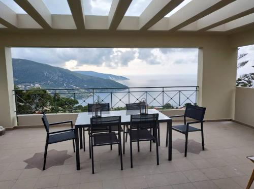 a table and chairs on a balcony with a view at Villa Sofia with an amazing view in Angón